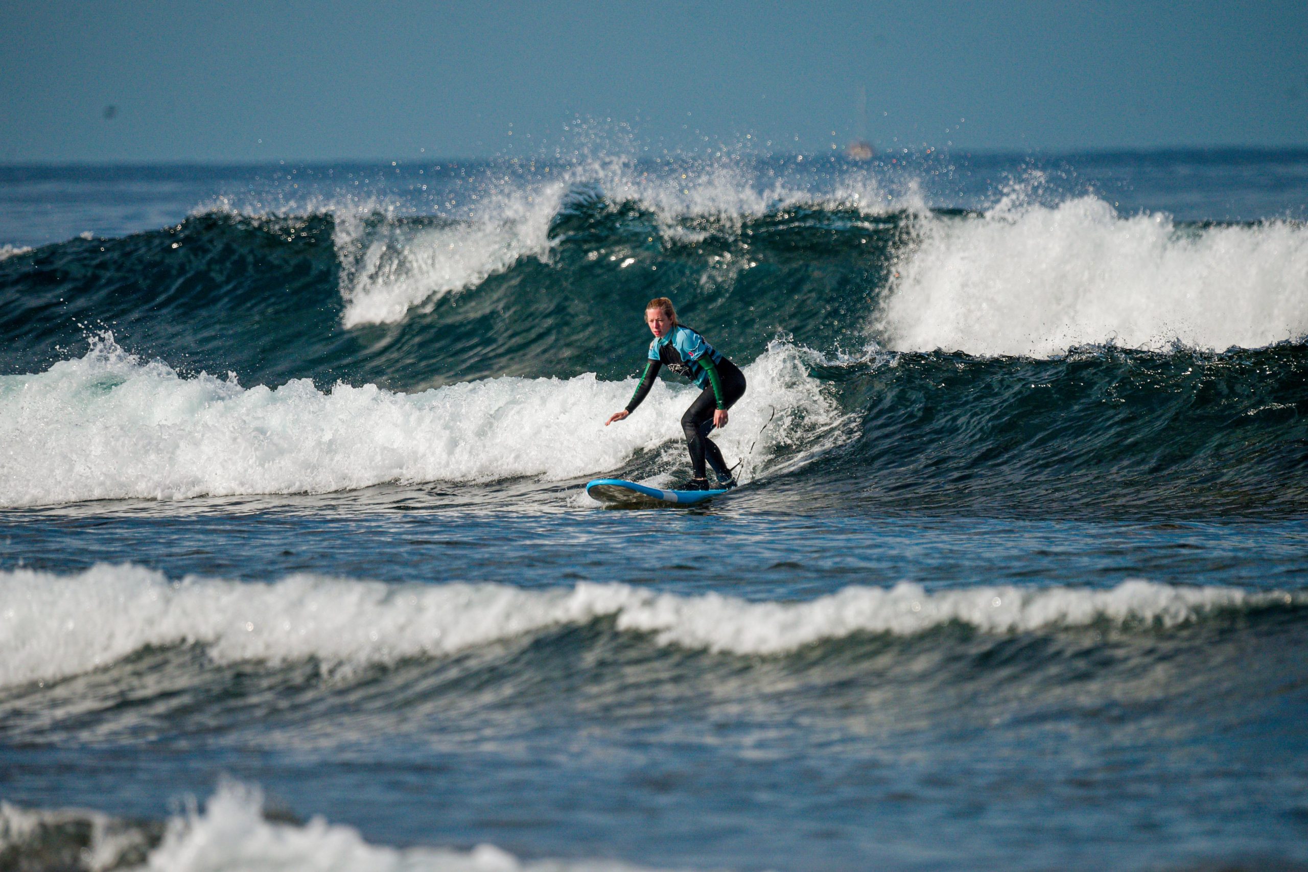 Blackstone Surf Center student surfing in Playa las Américas in Tenerife during a surf lesson