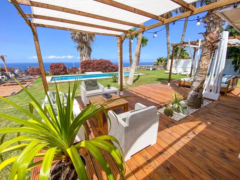 Beautiful terrace with swimming pool and flowers in the Blackstone Surfcamp in Tenerife in Canary Islands